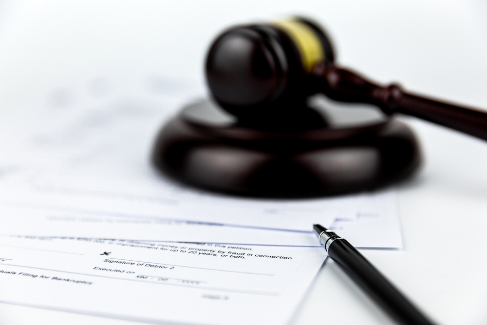 image shows court gavel and foreclosure document