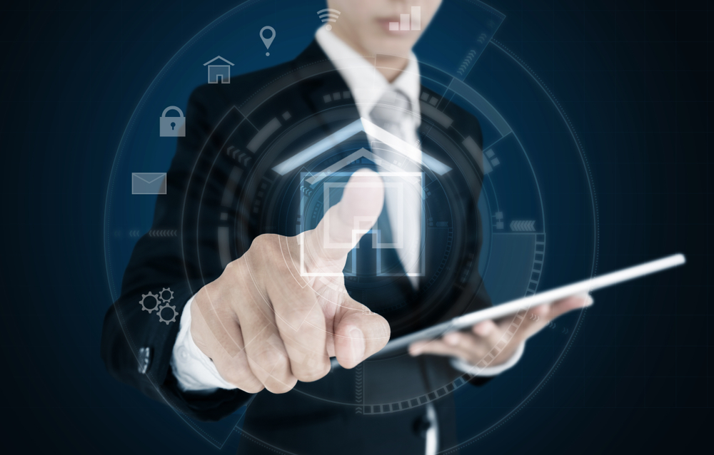 image shows high tech photo illustration man pointing at virtual home